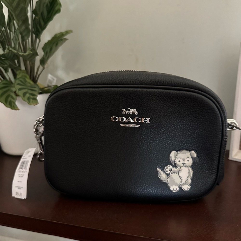 Coach Jaime camera bag with happy dog